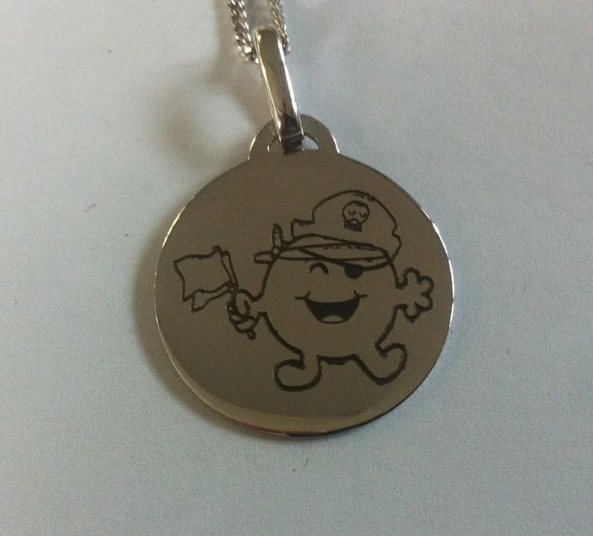 Gravure sur médaille ou pendentif