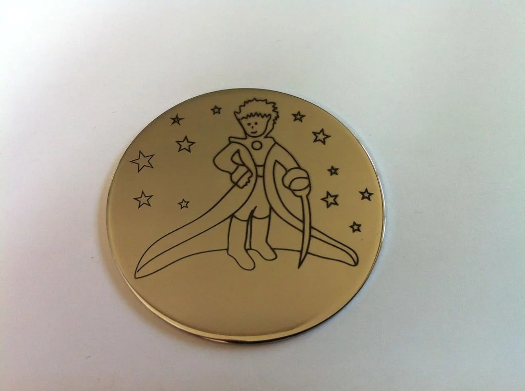 Gravure sur médaille ou pendentif