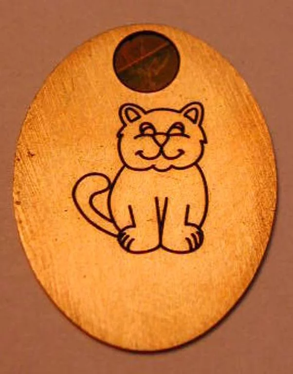 Gravure sur médaille ou pendentif