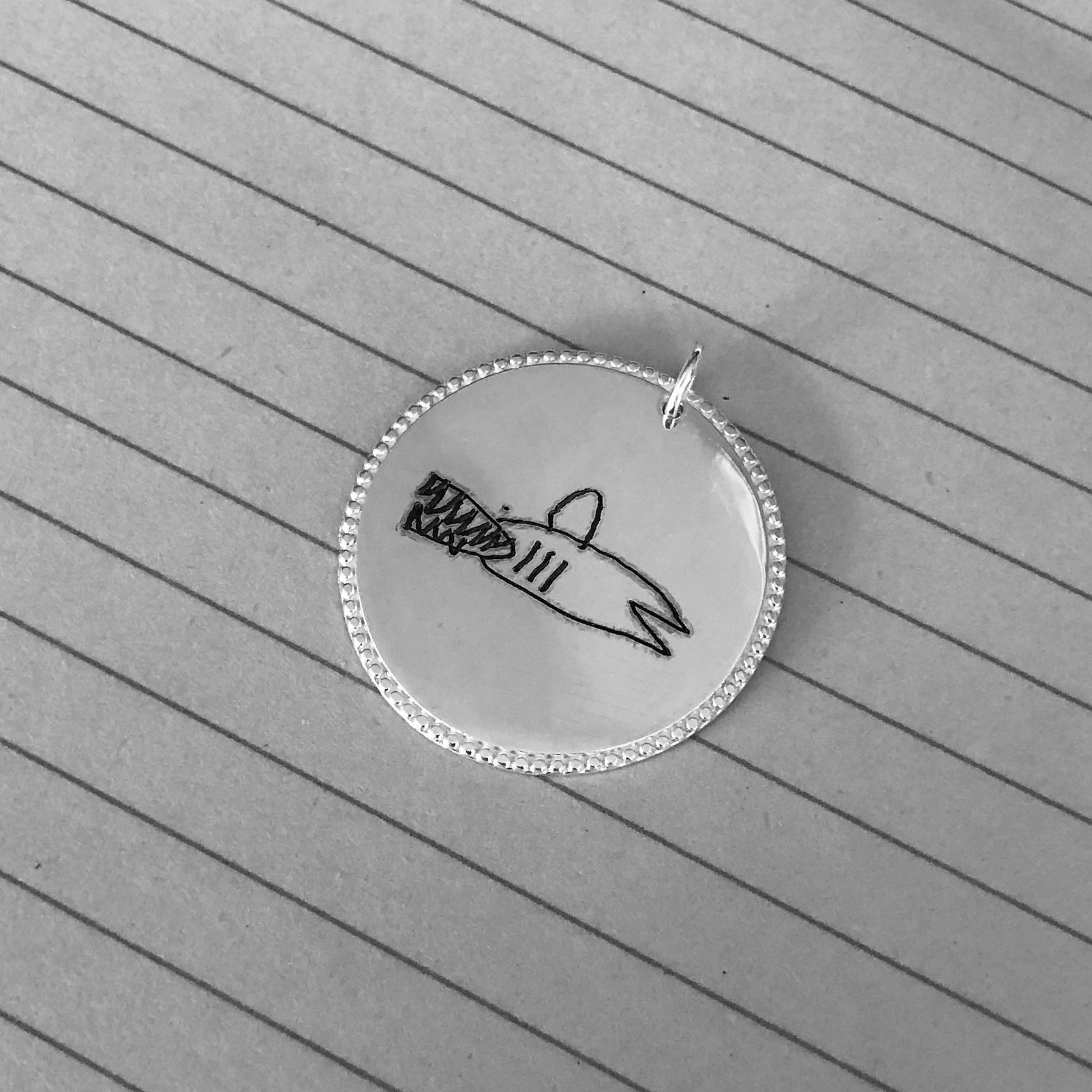 Gravure sur médaille ou pendentif