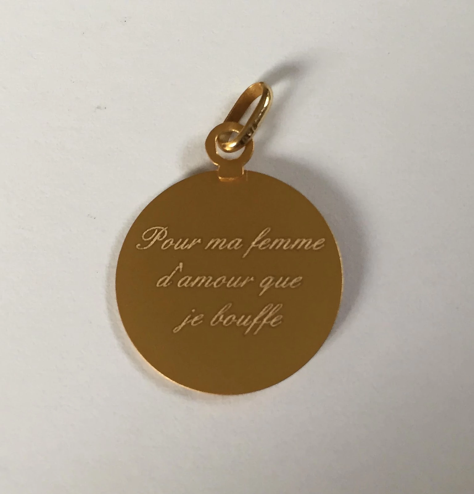 Gravure sur médaille ou pendentif