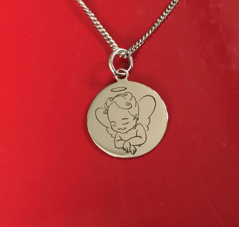 Gravure sur médaille ou pendentif